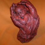 Baby In Hands Statue